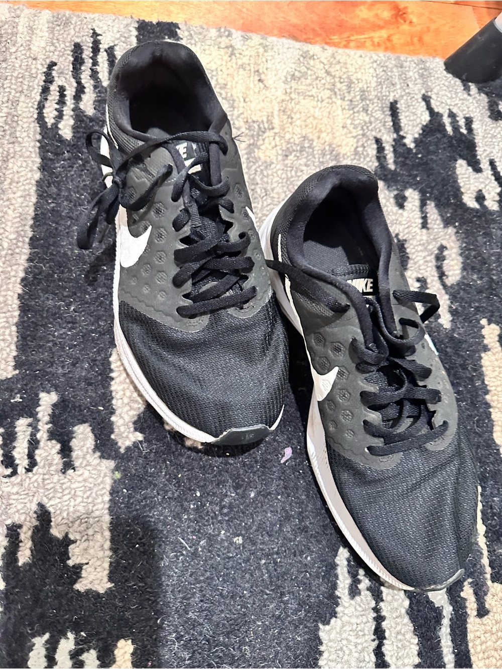 Nike Black Athletic Sneakers with White Swoosh Accent